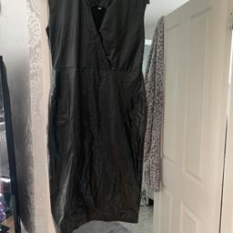 Black stretch dress body shaping dress I would say it’s fits a 14/16