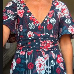 Excellent condition. Deep v to front, slight oval shape gap at back with neck tie. Side zip. Fully lined. Label has come detached at one side. Length aprx 37.5” shown on 5’2”