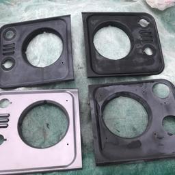 Used Landrover defender front headlight light surround. You are purchasing one £12 each but, I have four available. 1 silver LR51107. LH. 3 black 2 x RH and 1 x LH. The pair of black ones DHH100780.