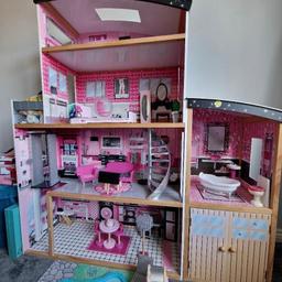large wooden dolls house. Used but in good condition. Dimensions W 130cm, H 135cm, D 34cm. accessories shown are included. collection only