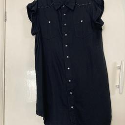 Long length black denim tunic style shirt top with cropped sleeves, pockets and rounded hemline and has glass effect buttons and has stud patterning on front and back. Please see photos. No label but never been worn. If you require postage please ask first using question option. Thanks very much