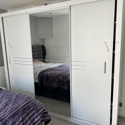Swedish wardrobe design. Got 5 years ago. Still good. It has hanging in the middle with mirror. Slide doors, and shelves on both side. Original price £800.