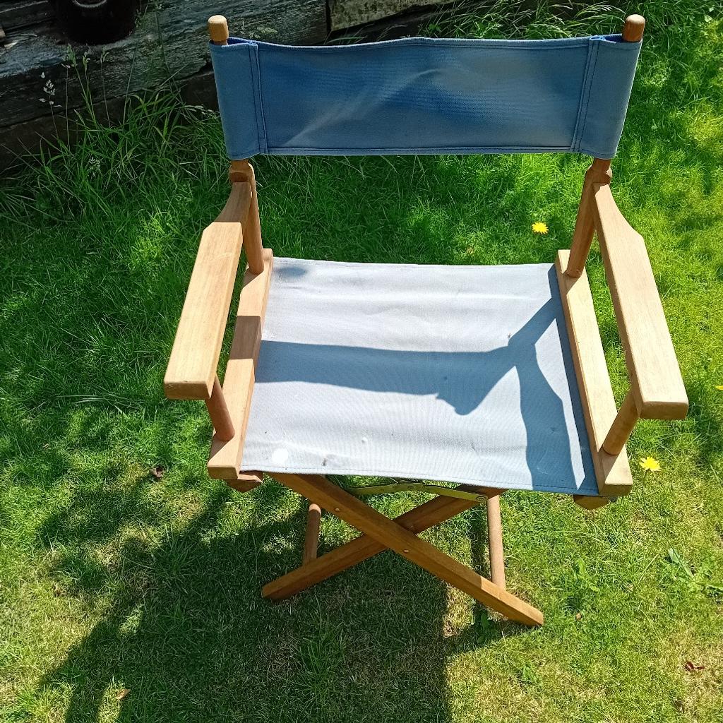 a folding wood and canvas chair