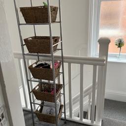 Tall metal shelf unit with wicker baskets some rust but still looks nice collection preferred or can deliver local
