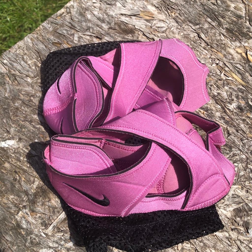 Nike studio wrap yoga dance shoes . Fit up to a 7 . Pink strappy soft shoes with non slip sole. Great for dance yoga Pilates etc . Come in mesh bag . Great shoes .