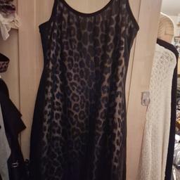 Leopard sheer dress. Leopard print dress with dress sheer style over the dress. In good condition.  Size 14. Collection Preferred but can be posted.