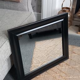 Black wooden framed mirror .Perfect condition,  as new. .. 64cm x 54cm .. Collection is from Hazel Grove, Stockport.