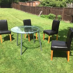 Glass table and 4 chairs in very good condition as per photos, please no timewasters or sfs thanks