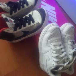 two pairs of nike trainers