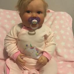 7 month June awake toddler reborn
Has full vinyl limbs and half vinyl body, rooted hair 
She takes a magnetic dummy 
Will go home with a dummy , outfit of my choice and a blanket 
Comes from a pet and smoke free home