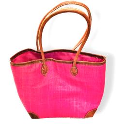 Raffia Magenta Medium Tote Bag with Leather Handles 
Looking for a unique and gorgeous everyday tote? This  vibrantly colorful and practical luxurious Tote bag has been handwoven from high-quality 100% raffia palm and dyed a vibrant magenta with eco-friendly dyes. 
Besides being crafted in super lightweight material, this durable bag features a Tote style, a breezy woven style, reinforced vegan leather corner protectors for an extra chic touch, vegan brown leather handles just long enough to go over the shoulder, open top with a coordinating polyester cloth drawstring top closure, a raffia inner pocket sewn in, and a modern, structured shape.
A fun and fabulous bag to be your ideal companion for work or play due to its generous compartment. Easily accommodates laptops and work documents etc or useful for shopping in the city center or can perfectly fit a beach towel and other sunny day essentials.
It's the go-to tote bag of the summer! 
This bag is handmade which makes it chic and un