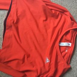Adidas crop top with open back and thumb sleeves, new never worn.