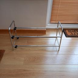 Chrome shoe rack 24 inches long 10 inch depth Extends to 36 inches.