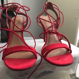 Red suede with gold tip on the laces, strappy heeled occasion sandals. New never worn