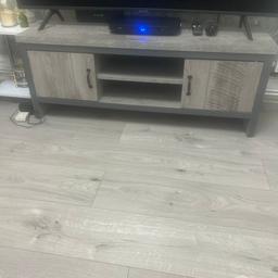 Lovey grey tv cabinet currently got a 55inch tv on it only selling due to redecorating
