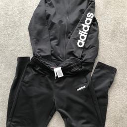 Black Adidas tracksuit Aged 13-14yrs
Worn lots but still lots of wear left in it 
Pet free smoke free home 
Buyer to collect but happy to post with postage extra
