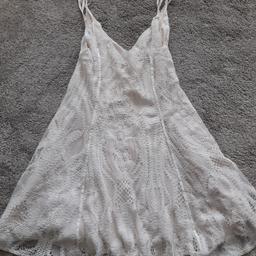 This beautiful strappy mini dress from Zara is new with tags. Lined. Cream lacey design. Flared skirt, heavy so hangs beautifully when worn. Size Medium, fits 12. RRP £45.99 so grab a bargain! Material viscose nylon and cotton mix. Hand wash. Lovely for holidays. Check out my other items. Happy to combine postage for multiple purchases or collection from DL5. Thanks for looking.