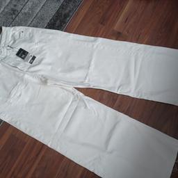 ladies white brand new distressed look wide leg jeans.£10 collection only.