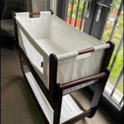 Snuzpod In Espresso. It comes with mattress, mattress protector and fitted sheets.

A unique crib which can be attached to the bed so baby is close to you. Has rocking feature

Used but excellent condition. Just some wear in some parts which can be easily painted over.(shown in picture)

No broken bits.

Rrp: £200