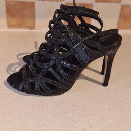 Ladies Next uk3 Black patent pattern high heels strappy sandals in fantastic condition 1st 2c will buy. See photos for condition size flaws materials etc. I can offer try before you buy option if you are local but if viewing on an auction site viewing STRICTLY prior to end of auction.  If you bid and win it's yours. Cash on collection or post at extra cost which is £4.55 Royal Mail 2nd class. I can offer free local delivery within five miles of my postcode which is LS104NF. Listed on five other sites so it may end abruptly. Don't be disappointed. Any questions please ask and I will answer asap.
Please check out my other items. I have hundreds of items for sale including bikes, men's, womens, and children's clothes. Trainers of all brands. Boots of all brands. Sandals of all brands. 
There are over 50 bikes available and I sell on multiple sites so search bikes in Middleton west Yorkshire.