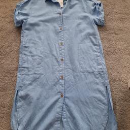 Brand new with tags, pale blue cool linen oversized shirt dress, midi length from Zara, size XS will fit 10 or 12, pit to pit is 22 inches. Contrasting brown buttons up front, collar, cap sleeves with shoulder strap/button detail. Side pockets and side splits. Check out my other items, happy to combine postage for multiple purchases when possible or collection from DL5. Ideal for warm sunny days or holidays. Thanks for looking.