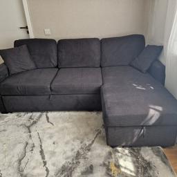 Sofa Bed with storage, charcoal color.
Comes apart in 2 parts.
3 big pillows and 2 small ones.

Kept in No smoking house and no pets.
Good condition needs some light cleaning.

One of the sitting pillows it's lower than normal.

Collection only