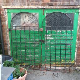 A set of wrought Iron gates. w35.5in h72.5in with bolt closing.