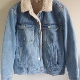 Ladies Topshop light blue denim jacket with a warm wadded lining. Size 16. Great quality and very warm. 100% cotton outer shell, 100% polyester lining and dry clean only. Used, but in a superb clean condition. As well as free collection from us, we also offer UK postal delivery for £3.19.