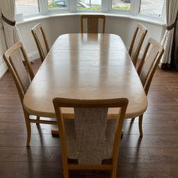 Solid light oak table with some marks noticeable. Table is 160 centimetres in length and 95 centimetres wide. Table can extend to 210 centimetres. 
6 Chairs, some with fabric threads pulled. Table can seat 6.