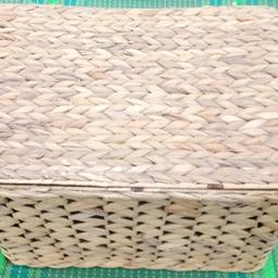 The baskets has a metal frame with the water hyacinth woven around it, integral handles in the shorter width ends and a water hyacinth wrapped around two rows of metal at the top in a vertical direction.

The lid is hinged for easier access, especially useful when the baskets are being used to store toys, car boot, small items etc.

Has served well for storage so can be painted, sprayed etc to suit your taste.

L46 x W45 x H22