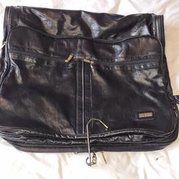 Luxury Stirling branded Suit/ Garment Bag/ Carrier. Excellent Condition 1st 2c Will Buy. It feels very much like soft leather but as I cannot find a label to confirm I have listed as both leather and Faux leather. It has 2 originally included collapsible coat hangers. 
See photos for condition size flaws materials etc. I can offer try before you buy option if you are local but if viewing on an auction site viewing STRICTLY prior to end of auction.  If you bid and win it's yours. Cash on collection or post at extra cost which is £6.95 Royal Mail 2nd class. I can offer free local delivery within five miles of my postcode which is LS104NF. Listed on five other sites so it may end abruptly. Don't be disappointed. Any questions please ask and I will answer asap.
Please check out my other items. I have hundreds of items for sale including bikes, men's, womens, and children's clothes. Trainers of all brands. Boots of all brands. Sandals of all brands. 
There are over 50 bikes available and I