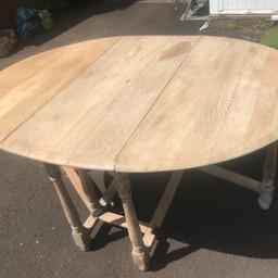 Used oval wooden drop leaf table. In used condition so, there is some marks and folds the legs away for space saving. 41-5” max width and max length 59” height 30”. When folded down length 41,5” width 18.5” and height 30”. lThere is a piece missing on the fold down area as pictured but, still useable.