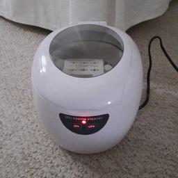 an ultrasonic jewellery cleaner, fill with warm water to max fill line and add some hand soap or washing up liquid.
put jewellery on stands or just in the bottom of the basket, ideally not touching each other as it's a sonic vibration that agitates the dirt out.
plugs in so sonic wave is always powerful
collect from wa5 7xd