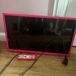 Pink TV and built in DVD player with the remote
Has wall bracket already attached to the back, but this can be detached 
In great condition