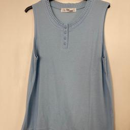 Light blue vest top. Colour blue lighter than photo…. more like a turquoise blue. Size is 14/16.