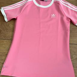 Pink adidas neoprene material t shirt , size 4 but would fit size 6 , cash on collection only