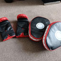 kids boxing gloves and pads .
these were used by my son when he was 13. but would probably fit younger .