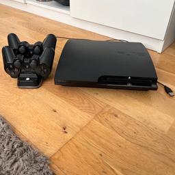 Been really well looked after not used for long as changed to Xbox 
Console with no damage 
2 genuine controls 
Plus charging docking station with lead