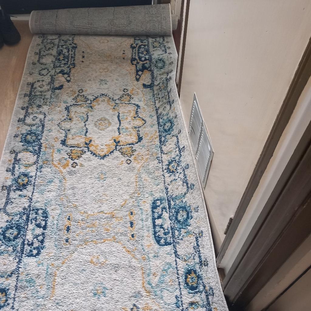 Extra long Persian runner. In good used condition. Suitable for long hallway.