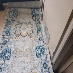 Extra long Persian runner. In good used condition. Suitable for long hallway.
