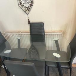 Dining table glass and chairs selling as seen in pictures pickup from Ilford