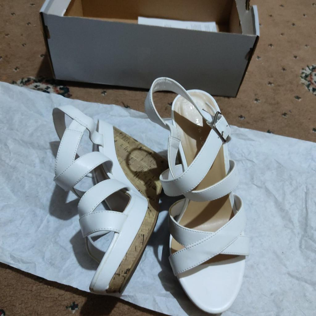 beautiful white colour wedges heel shoes from New look worn few times but no scratch marks on it very good condition