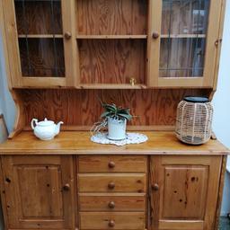Pine Welsh Dresser, it is in lovely condition. It is an antique/ vintage. It has a pretty leaded pattern on the glass doors. I am downsizing, hence reluctantly for sale. l am open to sensible offers. Due to this being a large heavy item it's collection only thanks
