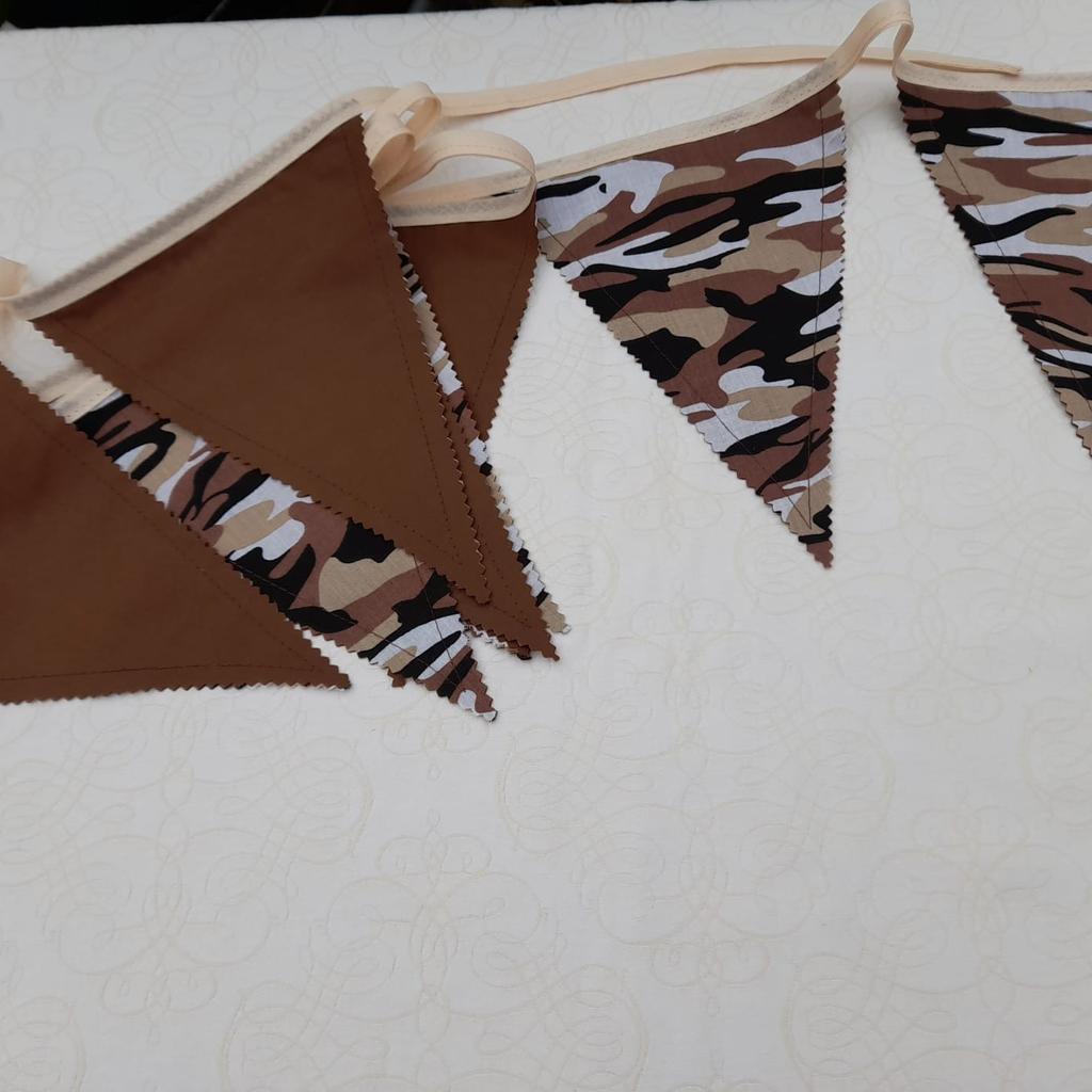 10 foot long material bunting. Made from polycotton material. Backs of flags are plain in colour. Edges are cut with pinking shears. Hand made. Combined postage available for multiple purchases.