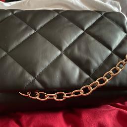 Brand new quilted black handbag ,it has a gold coloured strap to use as a hand bag or a clip on strap to carry on your shoulder