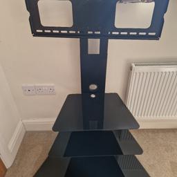 Black TV Stand with a swivel top for the TV to be watched at any angle.
