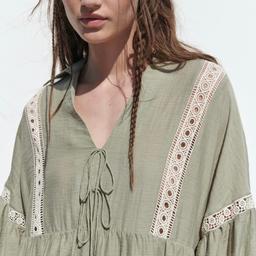 SIZE MEDIUM DRESS FROM ZARA

Johnny collar dress with tie details.
Long sleeves with elastic trim.
Contrast lace trims. Panelled hem.
Matching lining.
Colour - Light khaki
COMPOSITION

OUTER SHELL
36% viscose
33% cotton
18% nylon
13% linen
LINING
100% polyester