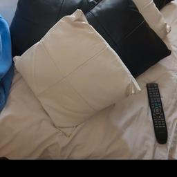 Black & White leather look pillows look great on a black leather sofa. 4 white & 4 black