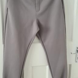 Ladies fashion Zara trousers in grey. Size Medium. Worn once, too small for me so am selling.