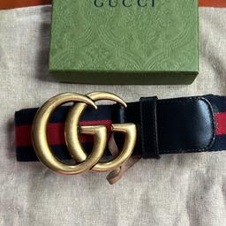 Good opportunity to acquire this genuine Gucci men belt . Used occasionally . Red and blue stripes with heavy buckle GG logo Please no silly offers . Cash on collection